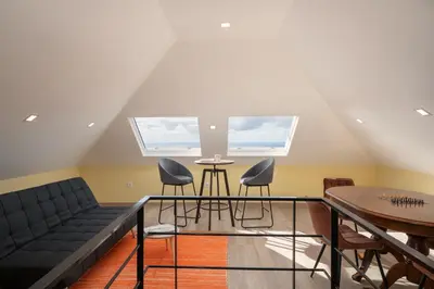 a living room with a couch and a table at Madeira Friendly Guest House by An Island Apart in Funchal