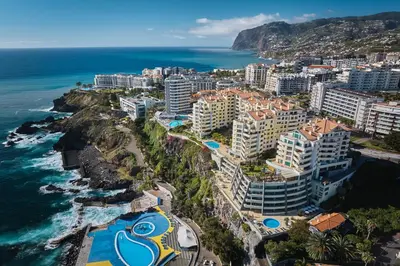 an aerial view of a resort next to the ocean at IVIS Home By Holiday Rental Madeira in Funchal