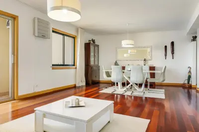 a living room with a white table and chairs at IVIS Home By Holiday Rental Madeira in Funchal