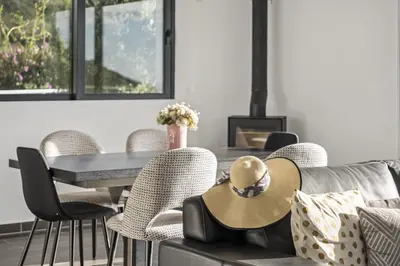 a living room with a couch and chairs and a table at Villa Soleil by Homie in Arco da Calheta