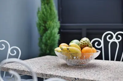 a bowl of fruit sitting on a table at Casa Francisco in São Vicente