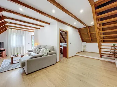 a living room with a couch and a table at Casa do Avô in Santana