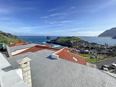 a view of the ocean from the roof of a house at Dinos Sea View in Machico