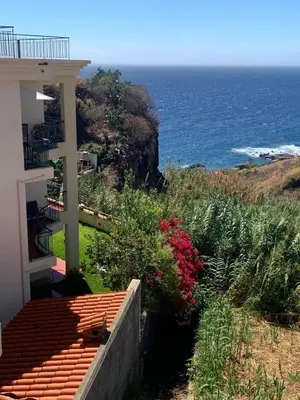 a house with a view of the ocean at Ocean View Condo in Caniço