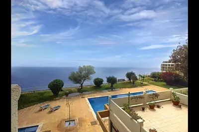 a view of the ocean from the balcony of a building at CloudyBay by Turin in Funchal