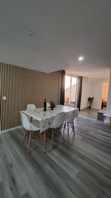 a dining room with a table and chairs at Casa Anjinho in Estreito da Calheta