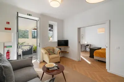a living room with a couch and a bed at Bela de Santiago II by An Island Apart in Funchal
