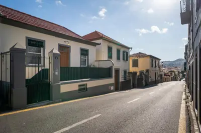 an empty street with houses on the side of the road at Bela de Santiago II by An Island Apart in Funchal