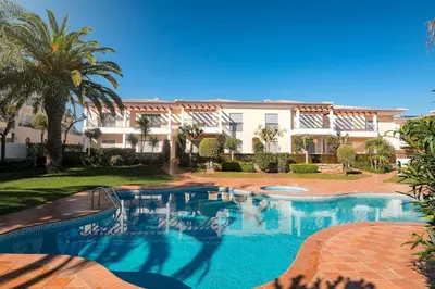 a large swimming pool in front of a building at Casa Clara Sun, Beach and Pool in Lagos