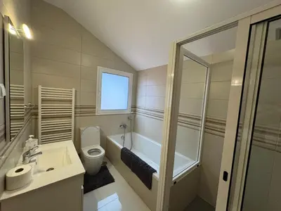 a bathroom with a toilet and a sink and a shower at Prazeres Natura in Prazeres