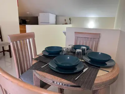 a wooden table with blue bowls and plates on it at Prazeres Natura in Prazeres