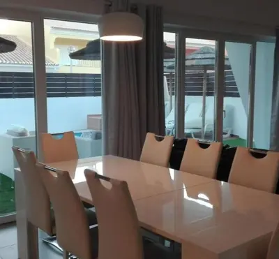 a dining room with a table and chairs at Villa Burgau in Lagos