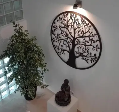 a mirror hanging on a wall next to a plant at Villa Burgau in Lagos