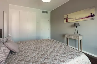 a bedroom with a bed and a painting on the wall at Luxury Villa Nogueira IV by Holiday Rental Madeira in Funchal