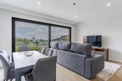 a living room with a couch and a table at Orquídea Apartment by Holiday Rental Madeira in Funchal