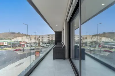 a building with a view of a street and buildings at Orquídea Apartment by Holiday Rental Madeira in Funchal