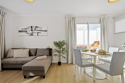 a living room with a couch and a table at City Centre Retreat by Homie in Funchal