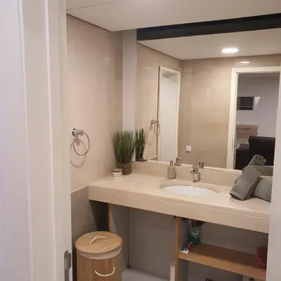 a bathroom with a sink and a mirror at Center Marina View Brown Studio in Funchal