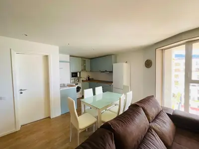 a living room with a couch and a table at Center Marina View Brown Studio in Funchal