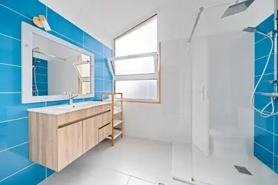 a bathroom with a sink and a shower at Petit Campanário in Campanário