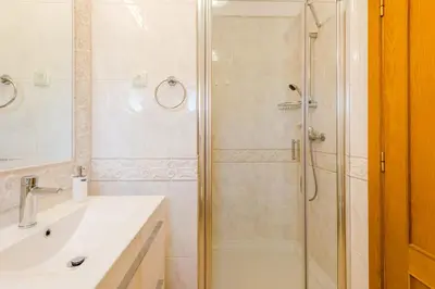 a bathroom with a shower and a sink at Casa Rosa1 at Boavista Resort in Lagos