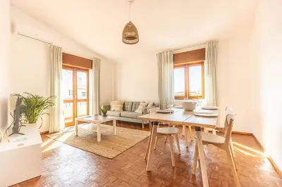 a living room with a table and a couch at Casa Calma I in Luz