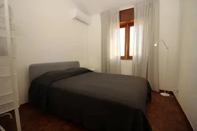 a bedroom with a bed and a window at Casa Calma I in Luz