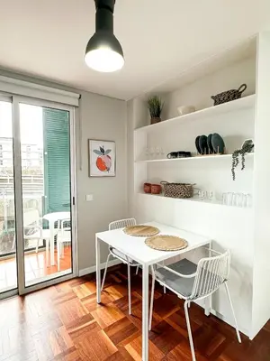 a dining room with a white table and chairs at Santa Luzia's Pearl II D - Studio in Funchal