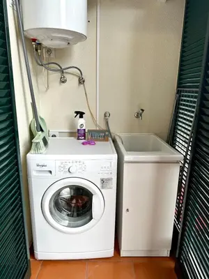 a washing machine and a sink in a laundry room at Santa Luzia's Pearl II D - Studio in Funchal