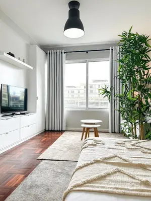 a living room with a bed and a large window at Santa Luzia's Pearl II D - Studio in Funchal