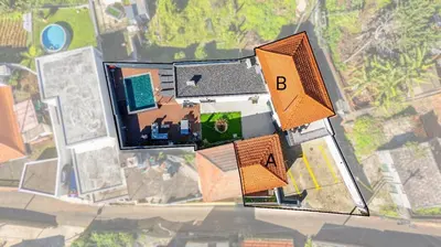 an overhead view of a house with orange roofs at Vila Sun House AB in Calheta