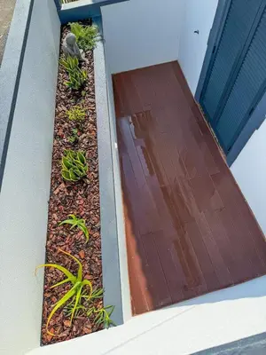 a garden on the side of a house at Vila Sun House A in Calheta