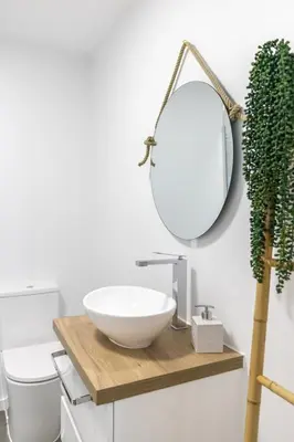 a bathroom with a sink and a mirror on a counter at Vila Sun House B in Calheta