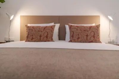 a bedroom with a bed with two pillows at Studio 118 in Funchal