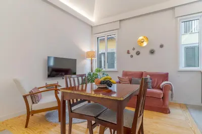 a living room with a table and a couch at Studio 118 in Funchal