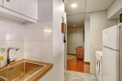 a kitchen with a sink and a refrigerator at Vista Formosa in Funchal