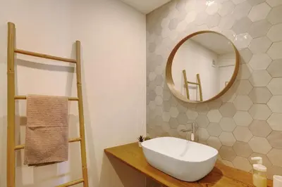 a bathroom with a white sink and a mirror at Vista Formosa in Funchal
