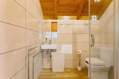 a bathroom with a toilet and a sink at Refugio Da Xamusca in São Vicente
