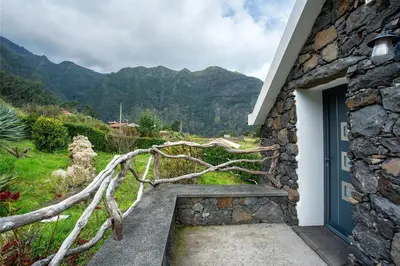 a doorway to a house with a mountain at Refugio Da Xamusca in São Vicente