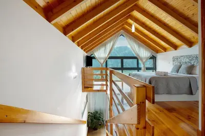 a kitchen and dining room with a table and a view at Refugio Da Xamusca in São Vicente
