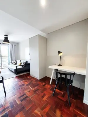 a living room with a table and chairs and a couch at Santa Luzia's Pearl I C - One Bedroom Apartment in Funchal