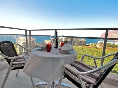 a table on a balcony with a view of the ocean at Apartamento Lugar do Mar ,wonderful sea view in Funchal