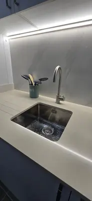 a kitchen counter with a sink in a kitchen at City Nest in Funchal