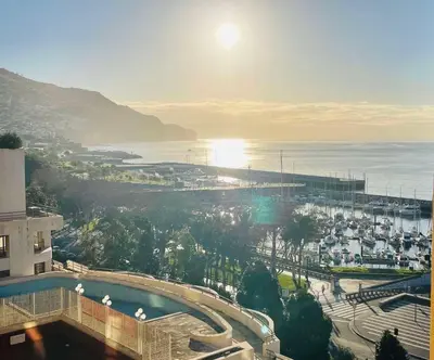 a view of a city and the ocean from a building at Center Marina view Gold Studio in Funchal