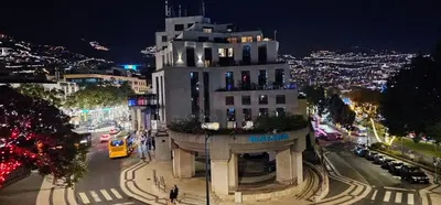 a building on a city street at night at Center Marina view Silver Studio in Funchal