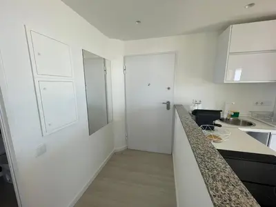 a kitchen with white walls and a counter top at Center Marina view Silver Studio in Funchal