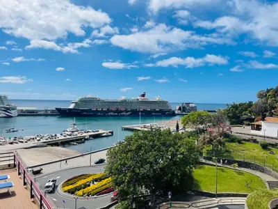 a cruise ship docked at a marina in a harbor at Center Marina view Yellow Studio in Funchal