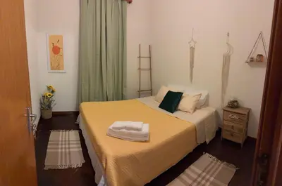 a bathroom with a white toilet and a bath tub at Descanso imparcial in Prazeres