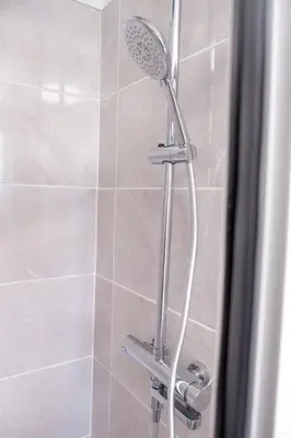 a shower with a shower head in a bathroom at GuestReady - Tranquil Retreat in Nature's Embrace in São Vicente