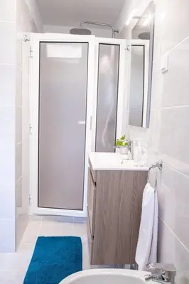 a bathroom with a sink and a mirror at GuestReady - Tranquil Retreat in Nature's Embrace in São Vicente